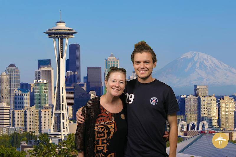 Author and son in front of faux backdrop at Seattle Space Needle (Credit: Space Needle)