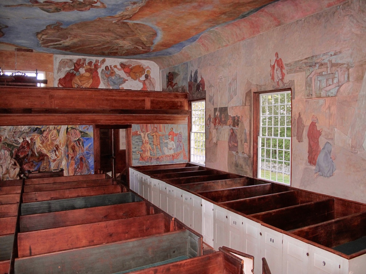 Colorful frescoes cover nearly every interior surface of the South Solon Meeting House